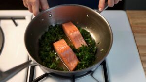 Add the salmon and herbs